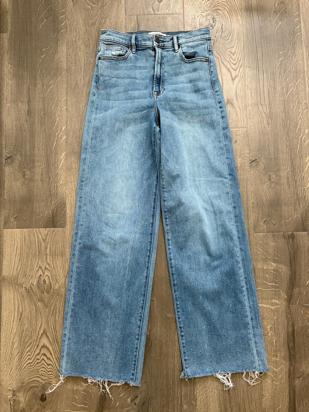 Hidden High-Rise Light Blue Wide-Leg Jeans with Raw Frayed Hem